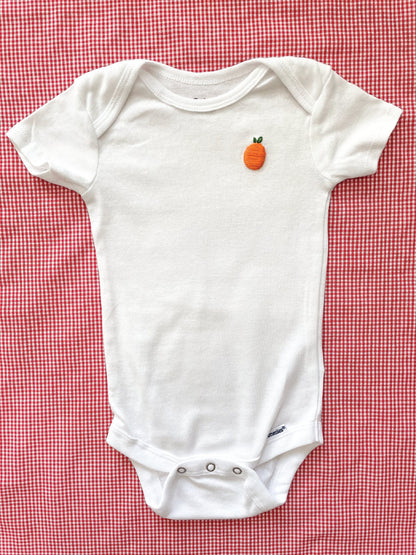 Orange hand embroidery on white baby onesie