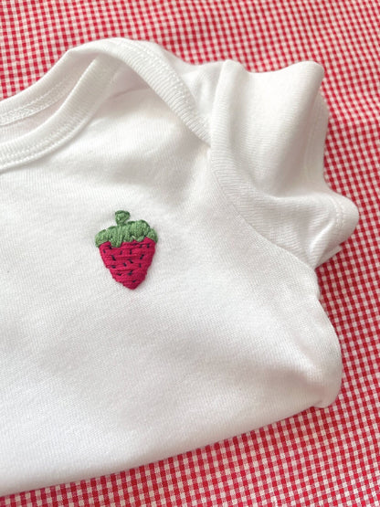 strawberry hand embroidery on white baby onesie